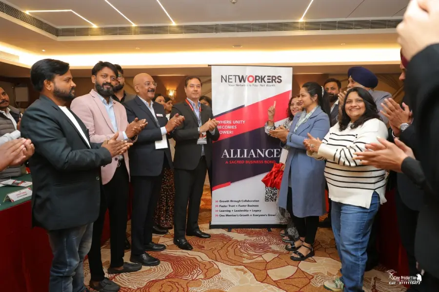 Members applauding beside the Alliance chapter banner